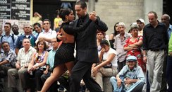Couple dancing tango on streets