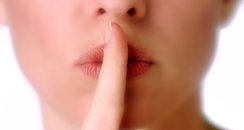 hush secret finger on lips