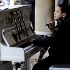 George Harliono plays piano in public