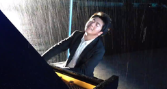 Lang Lang playing piano in the rain