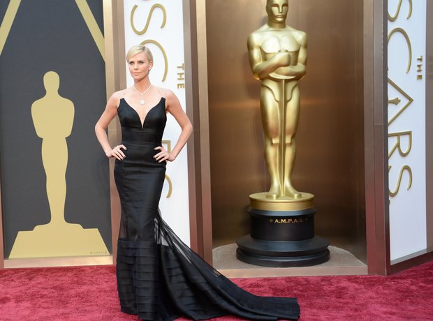 Charlize Theron at the Oscars 2014 red carpet