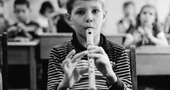 child playing recorder