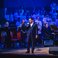 Image 1: Russell Watson and the AC Academy choirs perform