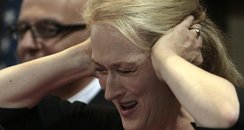 Meryl Streep covering ears