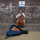 Image 1: busking cellist