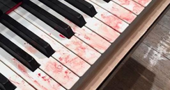 blood stained piano keyboard