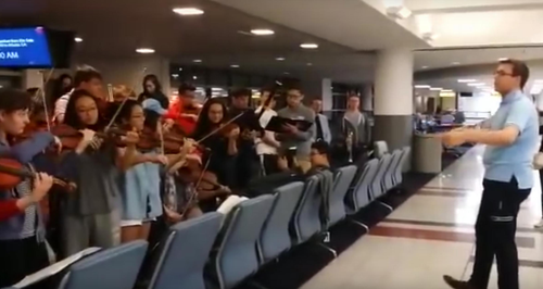 youth orchestra play elgar in airport