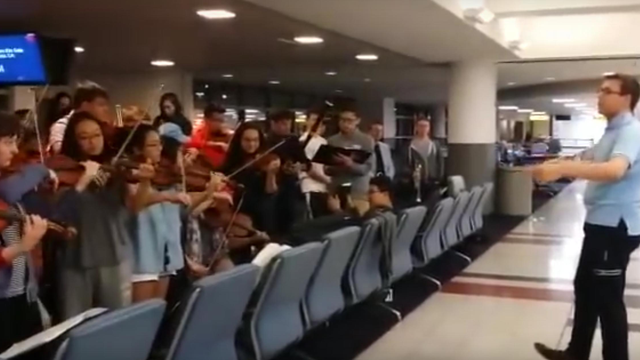 youth orchestra play elgar in airport