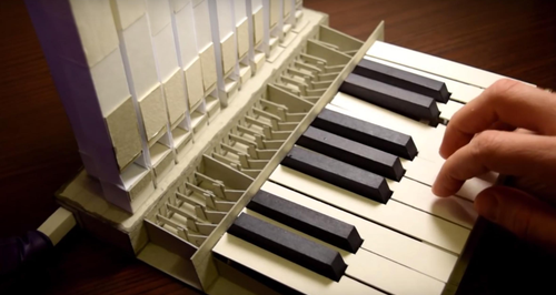 tiny pipe organ made of paper and cardboard