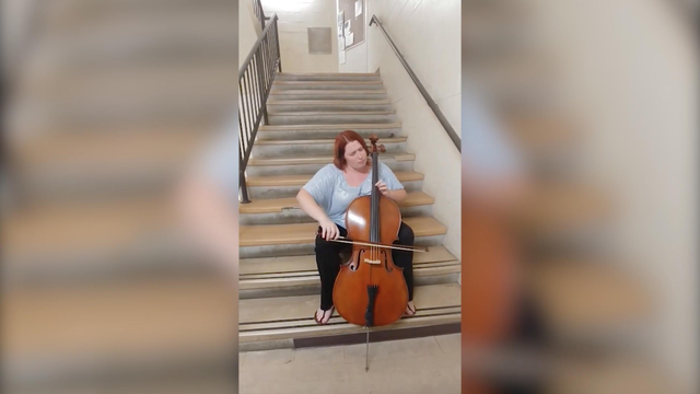 Cellist improvises in stairwell