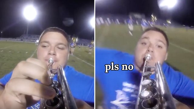 Marching trumpeter falls over spectacularly while 
